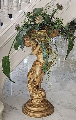 French-Style Carved Wood Cherub Planter. Includes Faux Floral Arrangement. 44" Tall With A 17" 