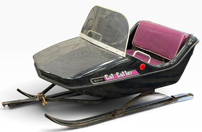 Arctic Cat Cutter. This passenger sleigh is designed to be pulled behind a snowmobile. This 