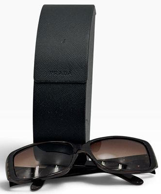 Prada Rectangular Sunglasses in Case. This lot features a pair of Prada rectangular sunglasses 