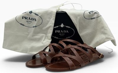 Prada Brown Vitello Strappy Flat Sandals in Box, Size 10 1/2. These Prada sandals feature a 