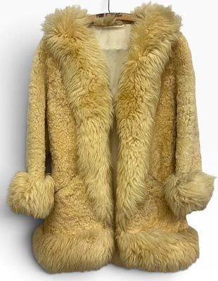Vintage New Zealand Sheepskin Coat by Suede-n-Wool. This statement piece was crafted in 