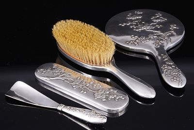 900 Silver 4-piece Toilet Set with Floral Relief, Wang Hing, China around 1900,. 900 silver 