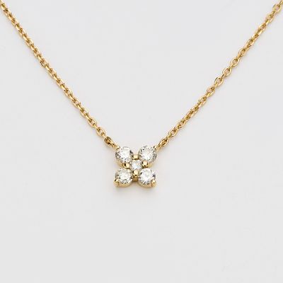 Tobillera en oro con flor de diamantes talla brillante. Peso diamantes: 0,20 ct. aprox. Peso 