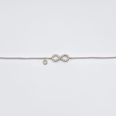 Pulsera en oro blanco con s&iacute;mbolo de infinito y chat&oacute;n de diamantes talla brillante. Peso 