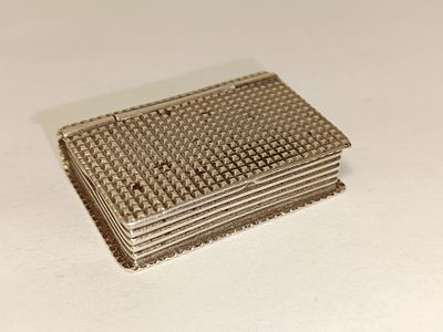 Book-shaped pill box in 835% silver, 20.7g 
4cm wide x 3cm long