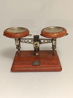 Wooden and silver scale figurine 7cm wide, 4.7cm high