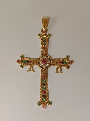 Cruz em ouro 800% com certificado GEMA CT com diamantes de 0.10 cts, 10 rubis de 0.30cts, 15 