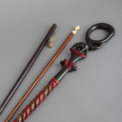 THREE DIFFERENT CANES. In different woods and other materials. Small defects, one with a 