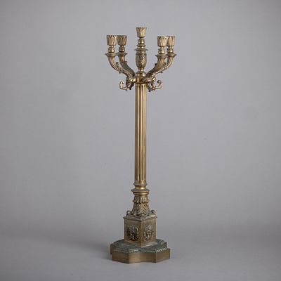 FIVE-LIGHT CANDELABRA. In gilded metal, fluted shaft, relief decoration of "acanthus leaves and 