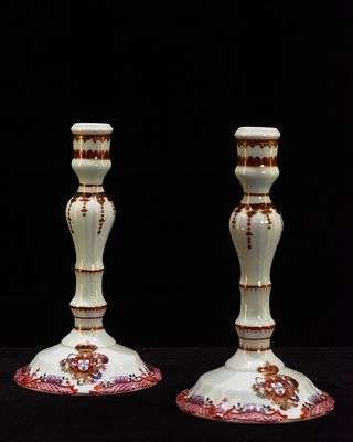 NG Porcelanas - Pair of Candlesticks. Pair of porcelain candlesticks decorated with the Rosa family 