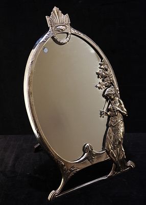 Art Nouveau table mirror. Art Nouveau oval tin dressing table mirror. Decorated with frame and 