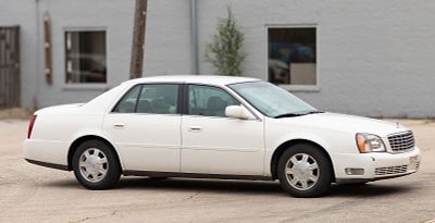 2004 Cadillac DeVille 4-Door Sedan VIN 1G6KD54Y04U179457, odometer reading 31,125, a key fob,