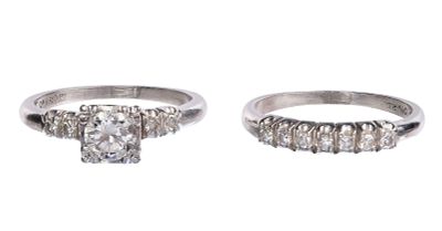 Platinum and Diamond Wedding Ring Set A center round cut diamond weighing approximately 0.52 