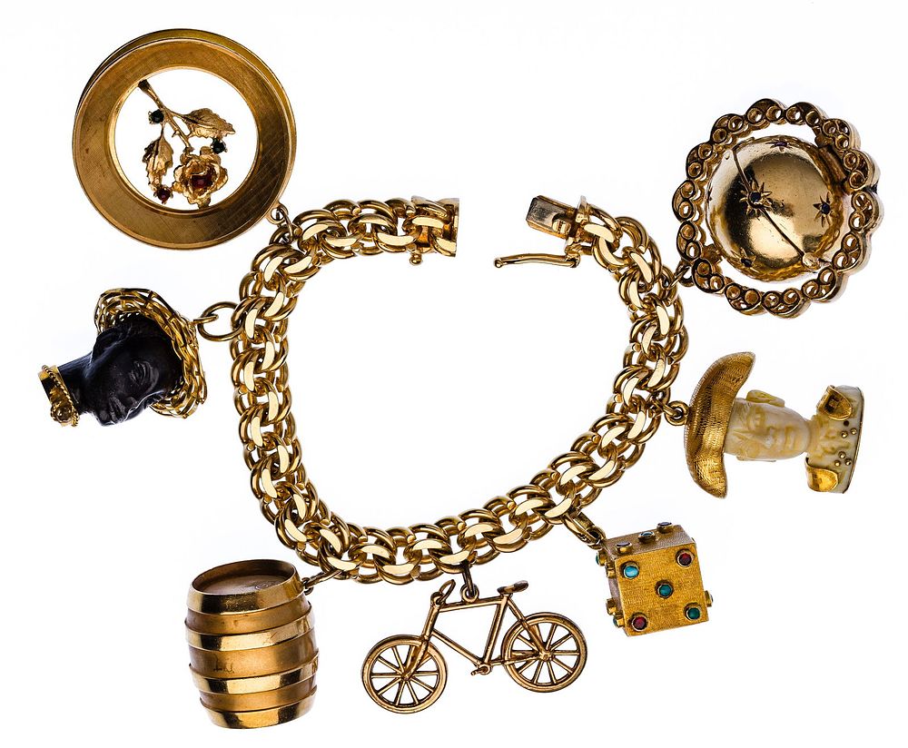Lot 177: 18k and 14k Gold Charms on Bracelet