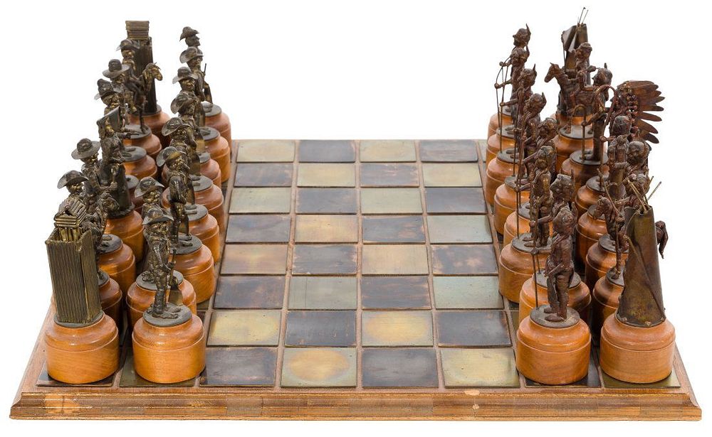 Lot 439: Charles Pratt (American, b.1937) 'Cowboys and Indians' Copper Alloy Chess Set
