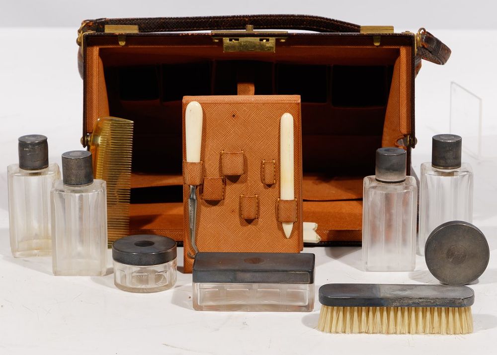 Lot 187: French Sterling Silver and Leather Bag Vanity Sets