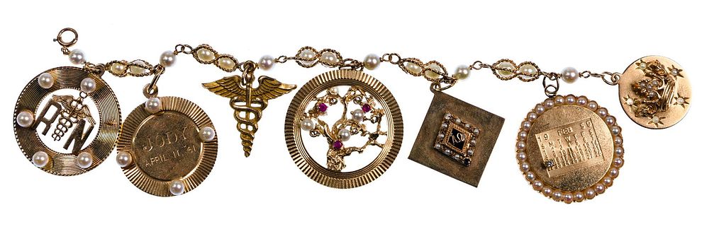 Lot 428: 14k Yellow Gold Charm Bracelet