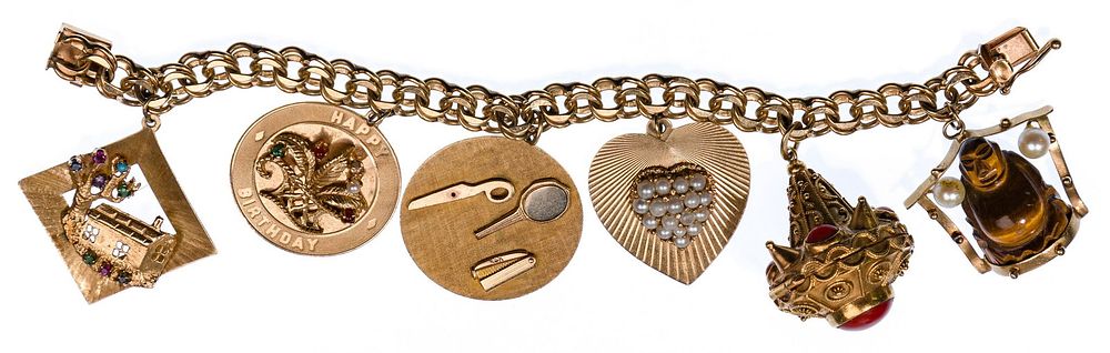 Lot 263: 14k Yellow Gold Charm Bracelet