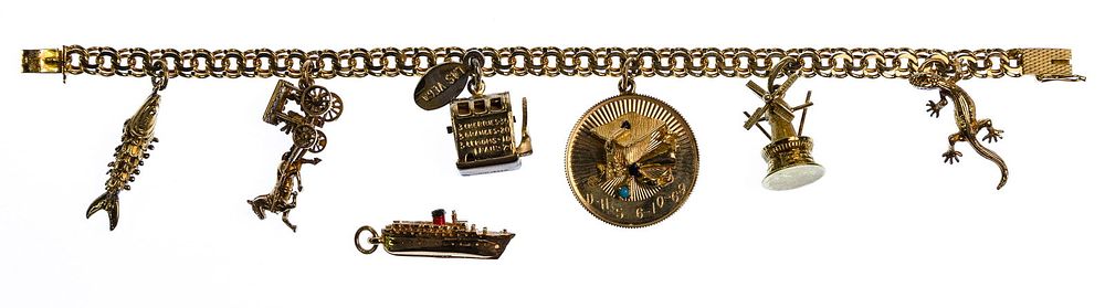 Lot 390: 14k Yellow Gold Charm Bracelet