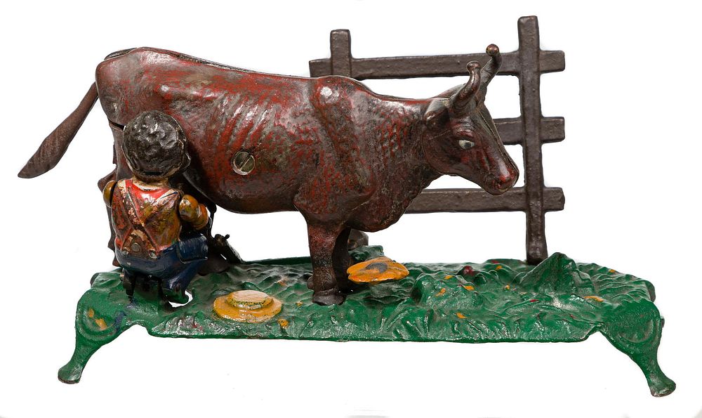 Lot 260: J. & E. Stevens Co. Boy Milking Cow Mechanical Cast