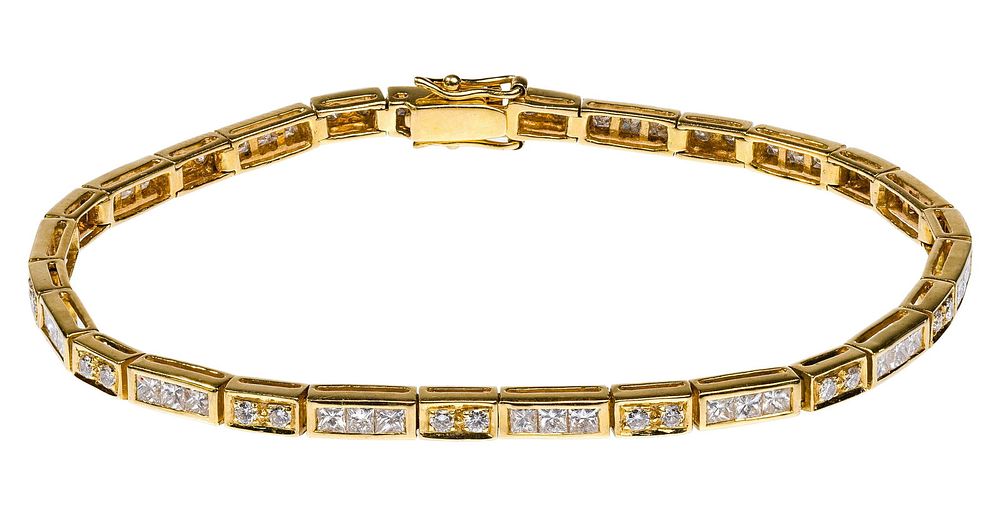 Lot 260: 18k Yellow Gold and Diamond Bracelet