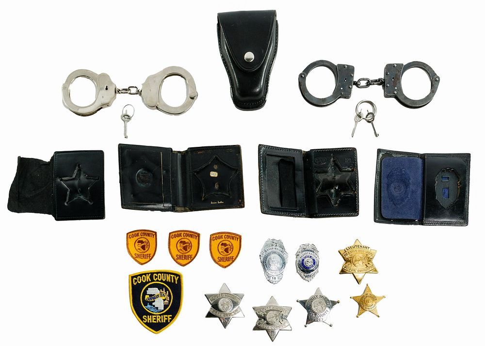 Lot 249: Badge and Handcuff Assortment