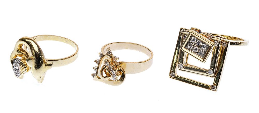 Lot 328: 14k Yellow Gold and Diamond Spinning Ring Assortment