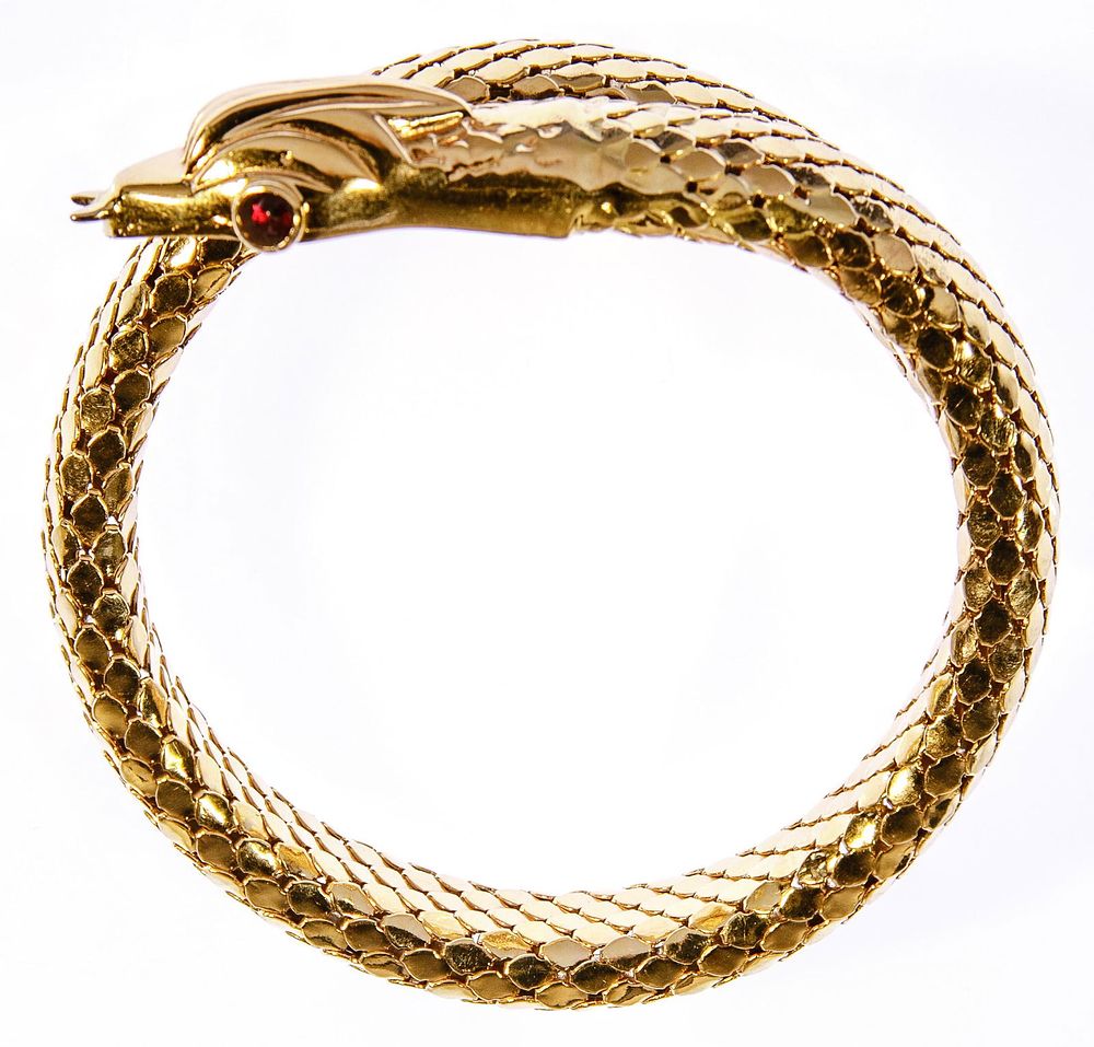 Lot 457: 18k Yellow Gold and Ruby Snake Form Cuff Bracelet