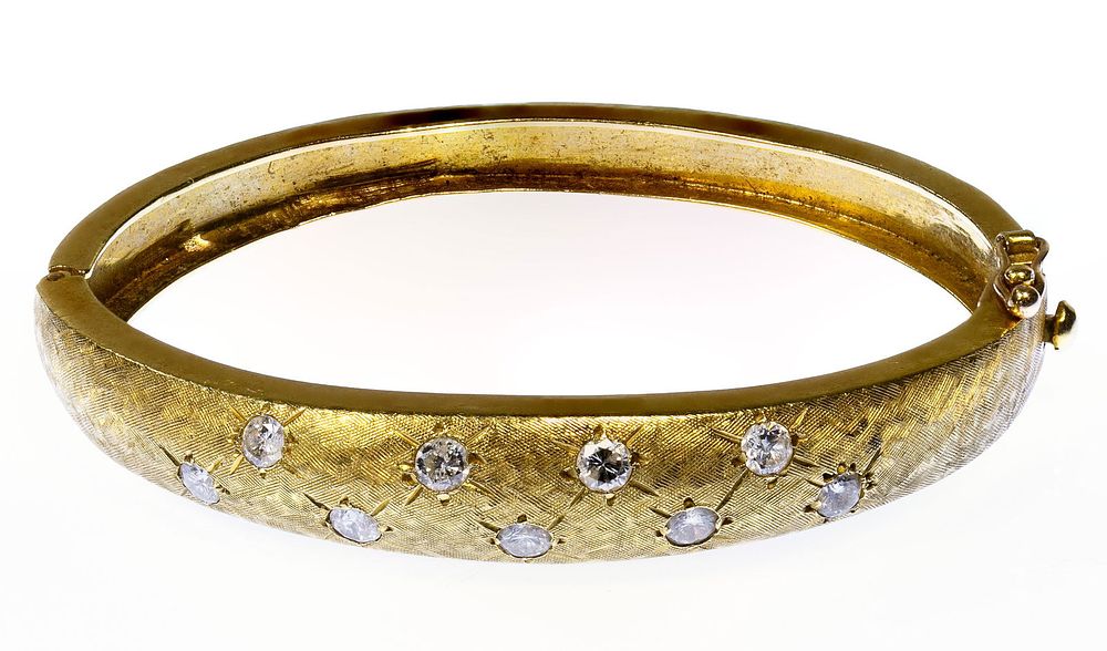Lot 288: 18k Gold and Diamond Hinged Bangle Bracelet