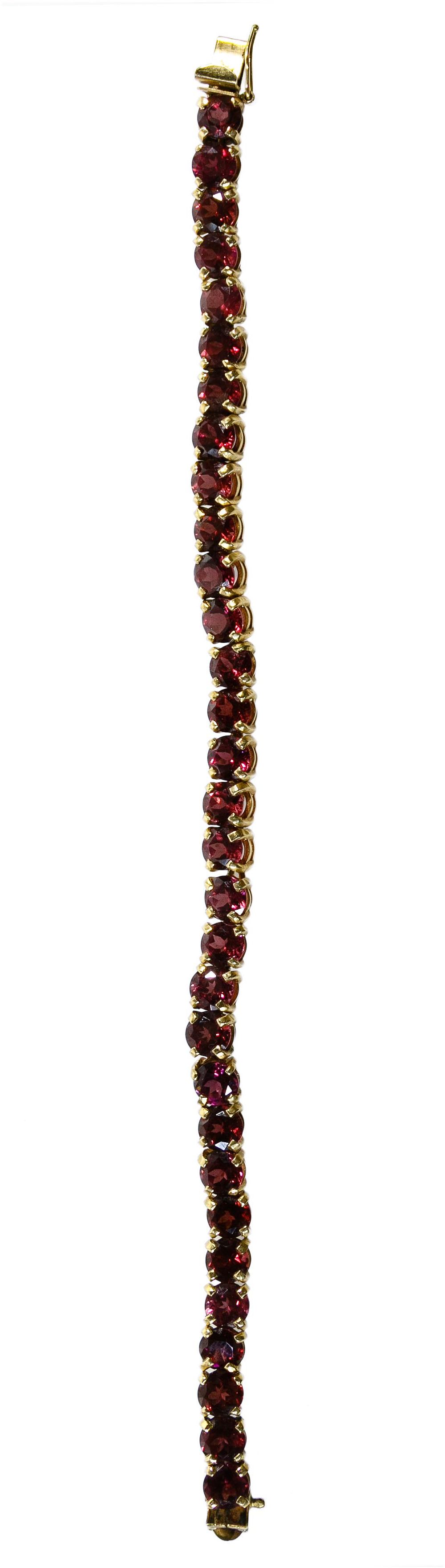 Lot 328: 14k Gold and Amethyst Bracelet