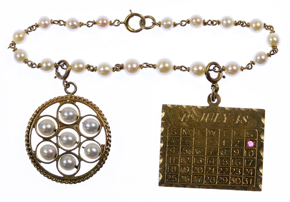 Lot 333: 14k Gold and Pearl Charm Bracelet