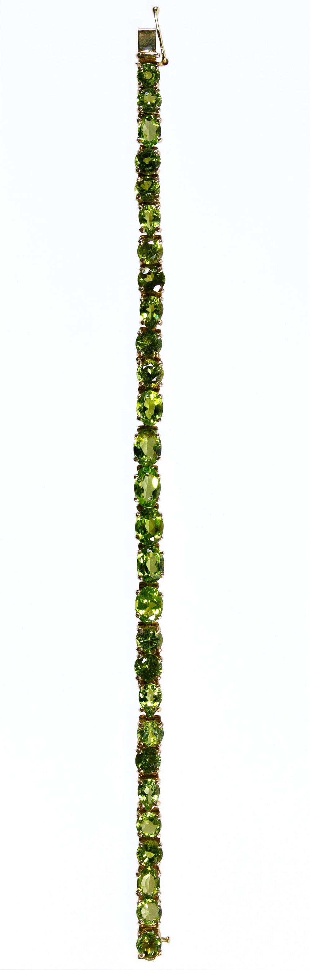 Lot 334: 14k Gold and Peridot Bracelet