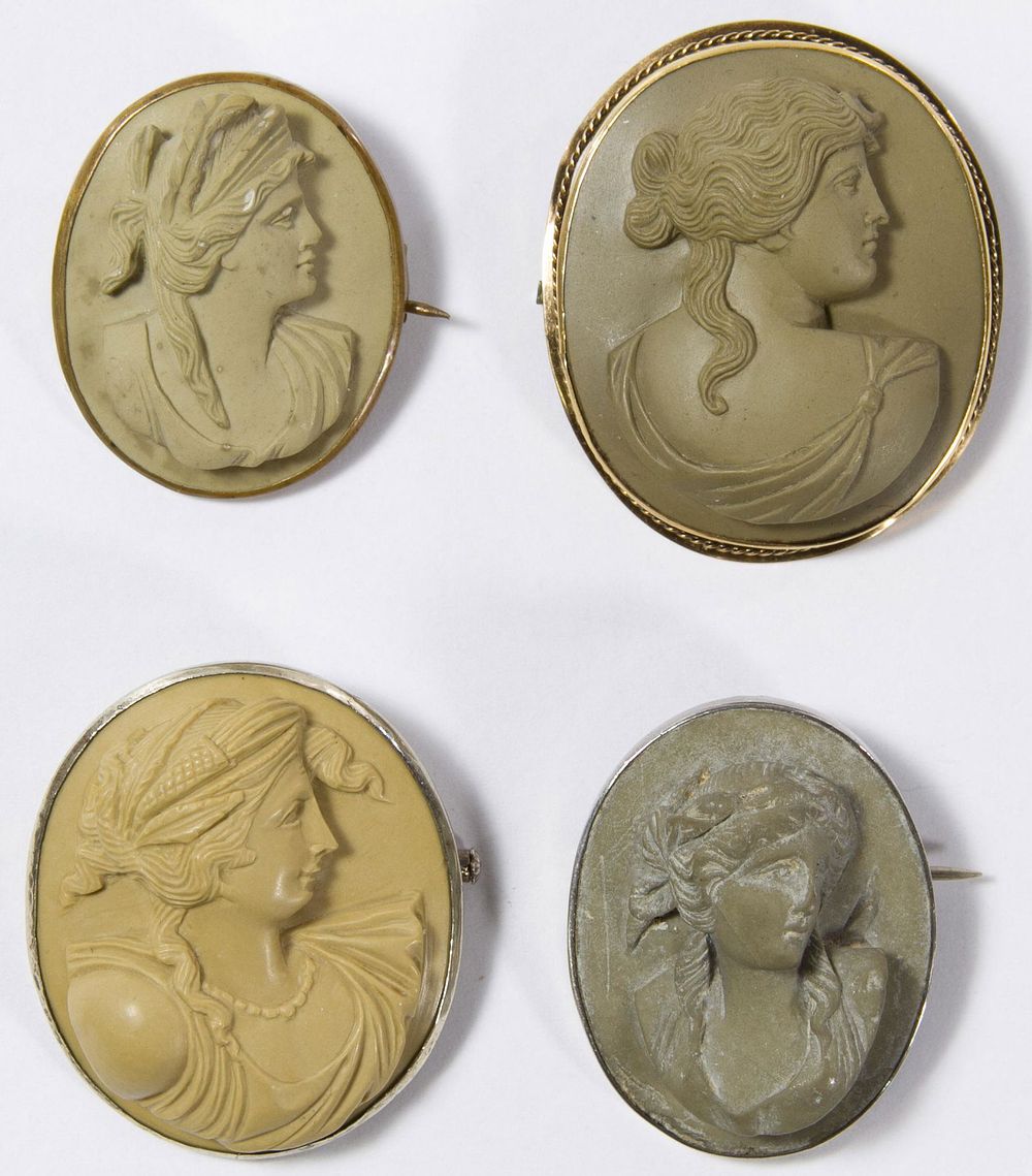Lot 444: Carved Lava Cameo Pin Assortment