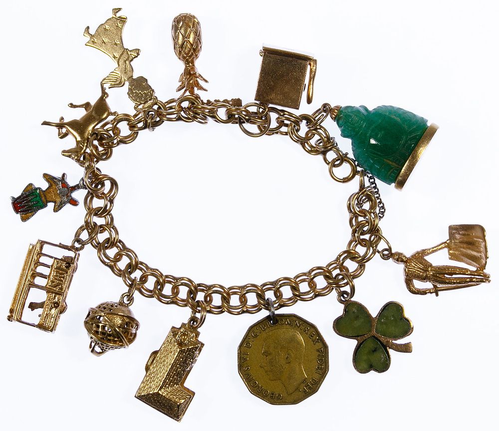 Lot 313: 14k Gold Charm Bracelet