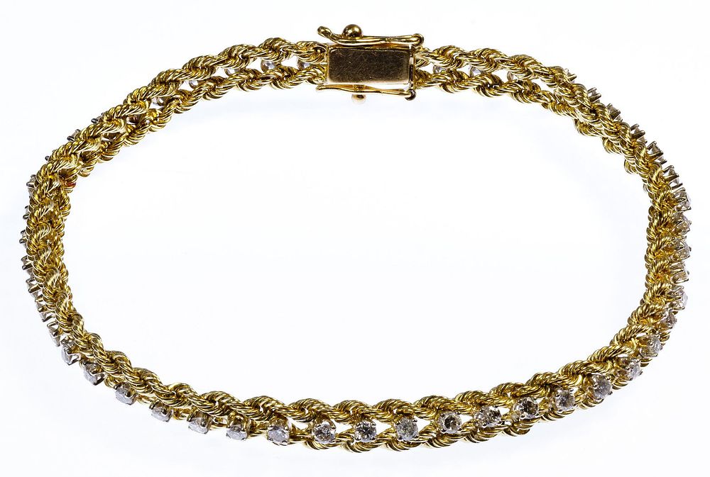 Lot 320: 14k Gold and White Sapphire Bracelet