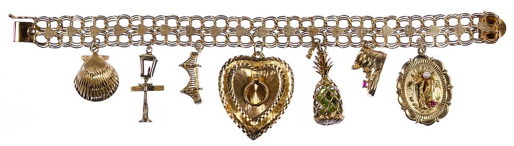 Lot 309: 14k Gold Charm Bracelet
