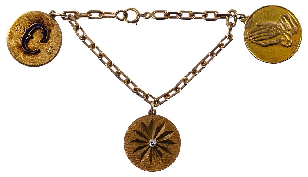 Lot 235: 14k Gold Charm Bracelet