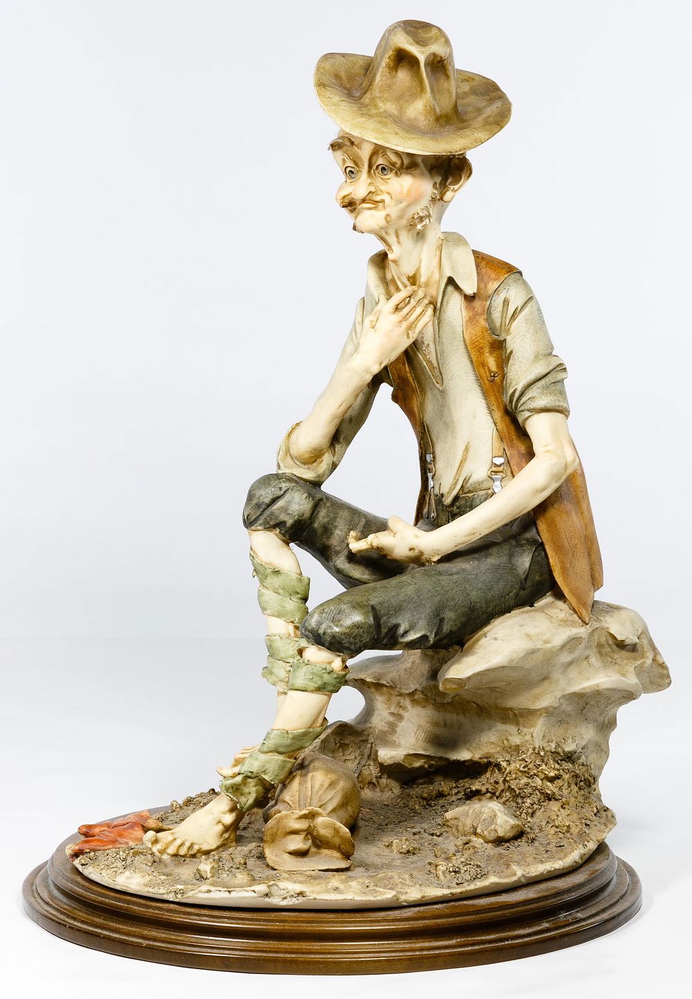 Lot 450: Capodimonte 'Bum on a Rock' Figurine