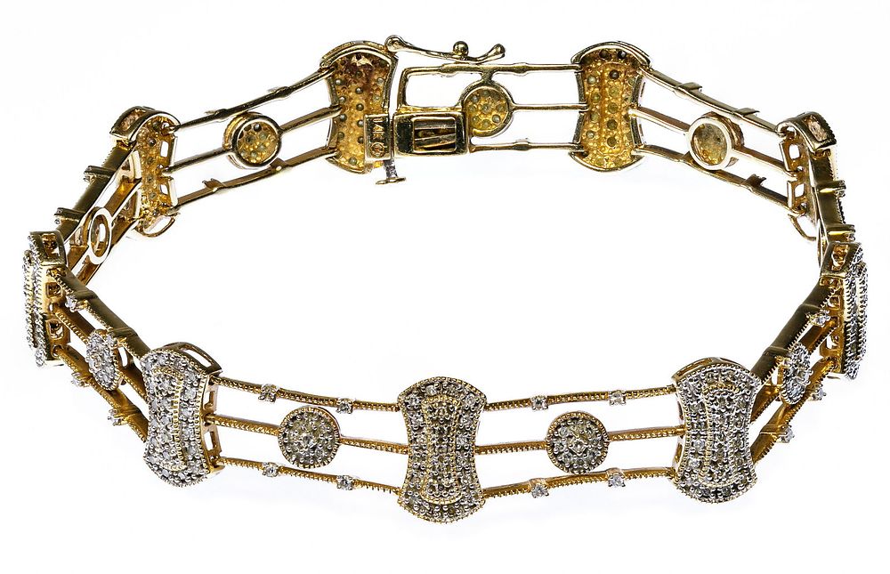 Lot 206: 14k Gold and Diamond Bracelet