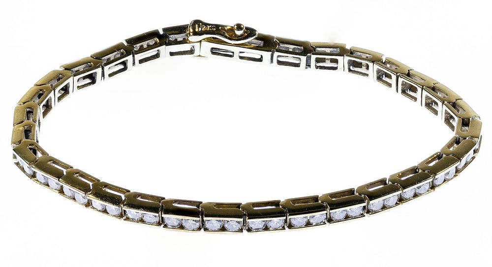 Lot 208: 14k Gold and Diamond Tennis Bracelet