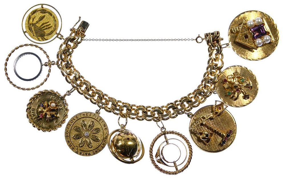 Lot 225: 18k Gold, 14k Gold and Gemstone Charm Bracelet