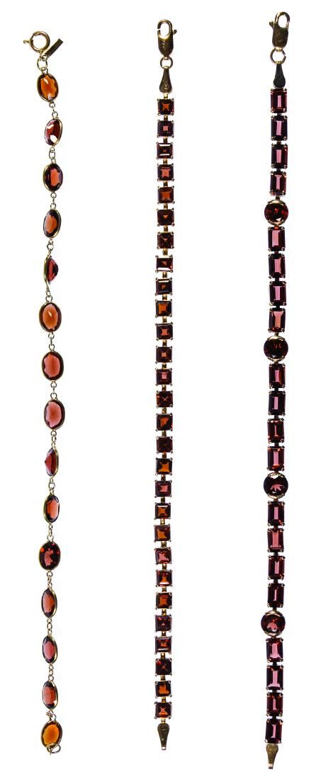 Lot 496: 14k Gold and Garnet Bracelets