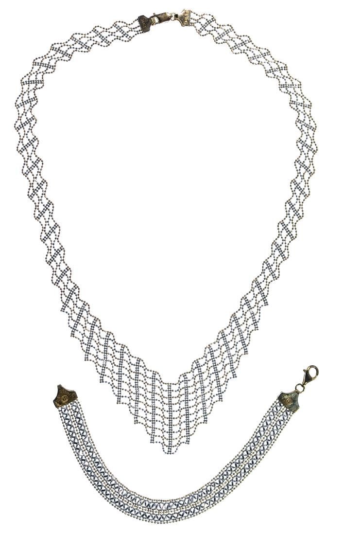 Lot 499: 14k White and Yellow Gold Necklace and Bracelet