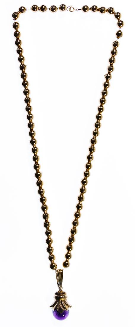 Lot 618: 14k Gold and Amethyst Pendant on Bead Necklace