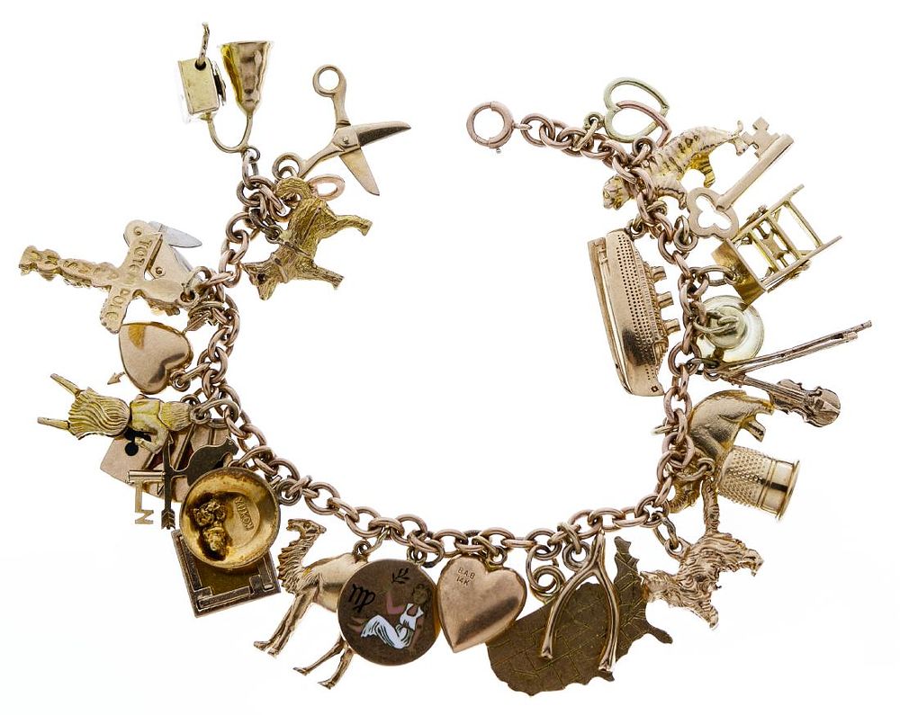 Lot 657: 14k Gold and 10k Gold Charms on 14k Gold Bracelet