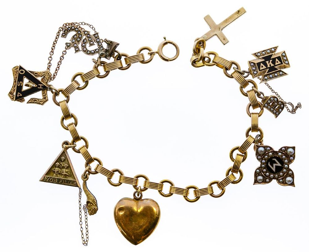 Lot 658: 14k Gold and 10k Gold Charms on 14k Gold Bracelet