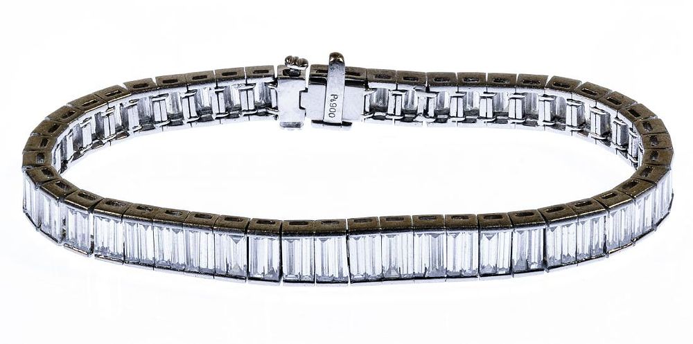 Lot 214: Platinum and Diamond Eternity Bracelet