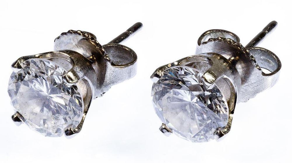 Lot 217: Platinum and Diamond Stud Pierced Earrings
