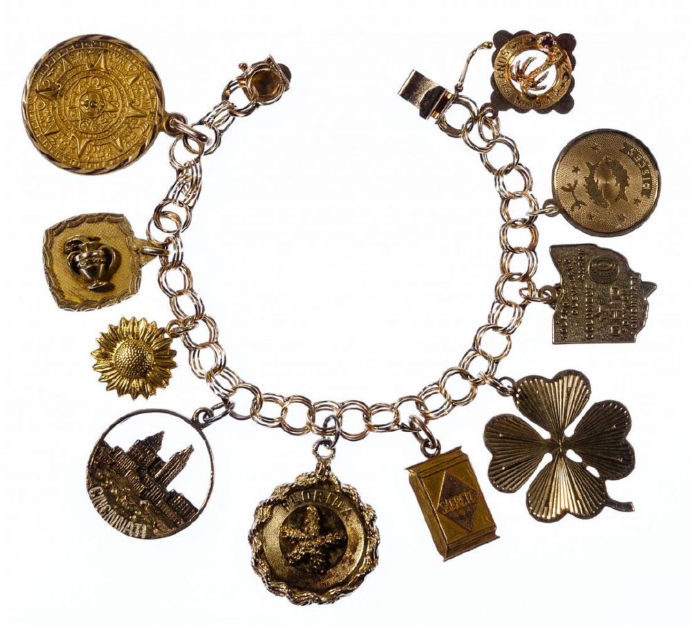 Lot 276: 14k Gold Bracelet with Mixed Gold Charms