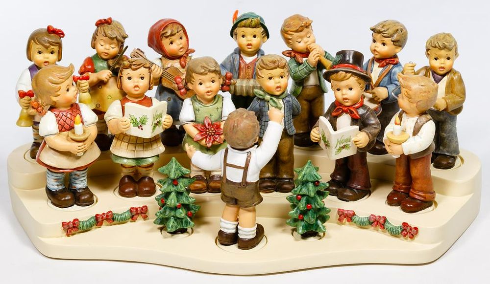 Lot 225: Hummel 'Christmas Choir' Figurine and Stand Collection